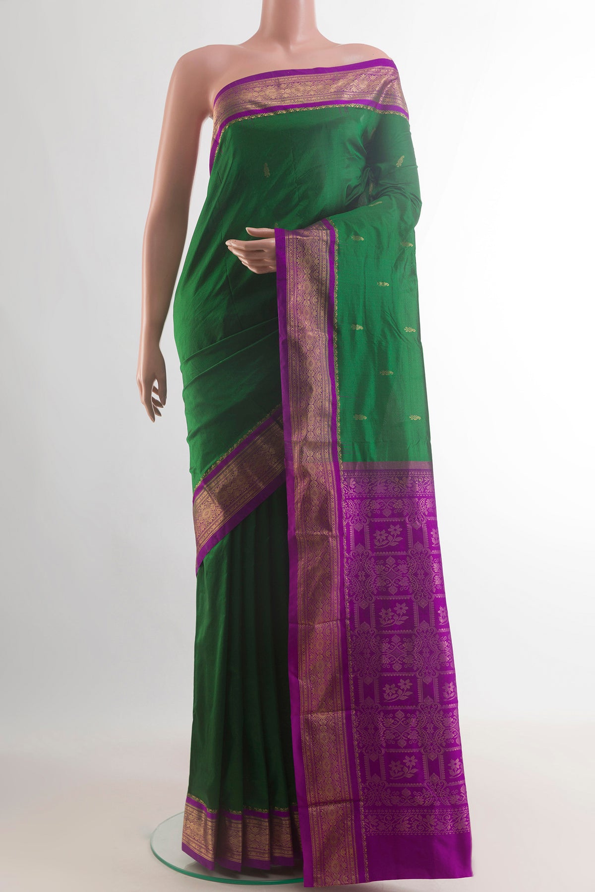 Pure Silk Green Bangalore Saree with Zari Butta on the body and Zari Border.  displayed on a mannequin