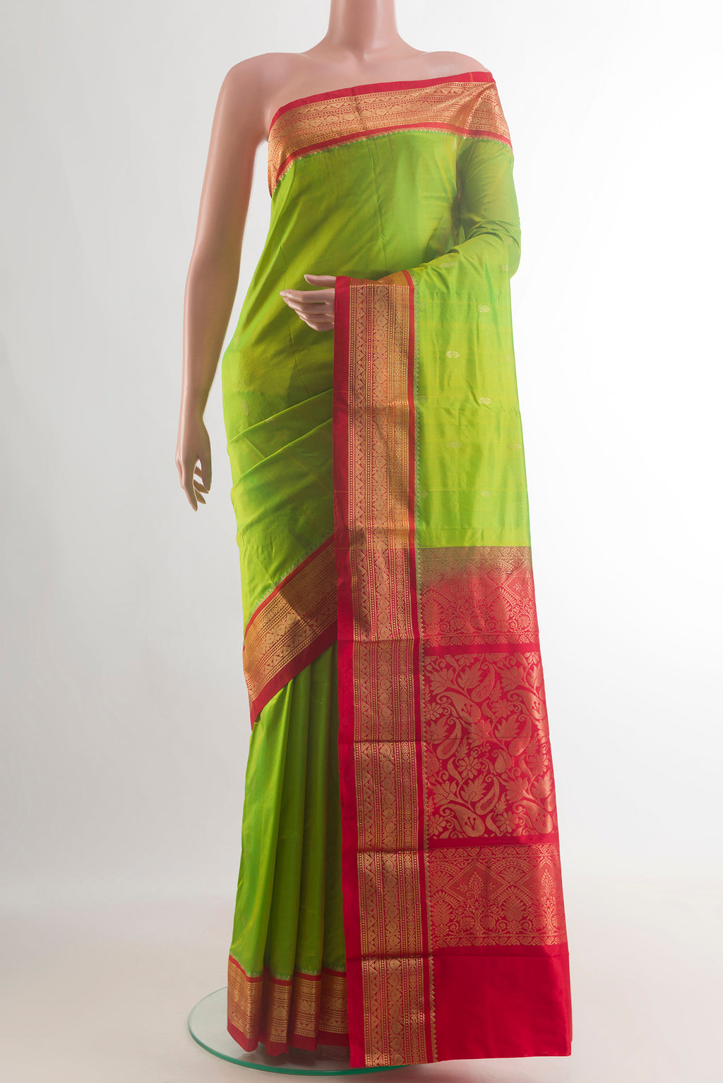 Pure Silk Parrot Green Bangalore Saree with Zari Butta on the body and Zari Border.  displayed on a mannequin