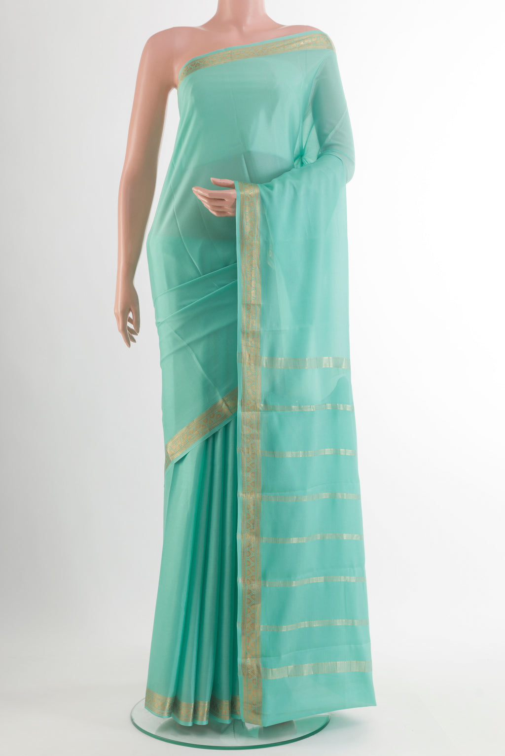Sea Green Mysore Crepe Saree with Plain Body and Zari Border.  displayed on a mannequin