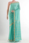 Sea Green Mysore Crepe Saree with Plain Body and Zari Border.  displayed on a mannequin