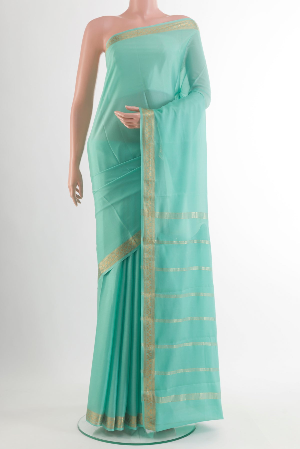 Sea Green Mysore Crepe Saree with Plain Body and Zari Border.  displayed on a mannequin