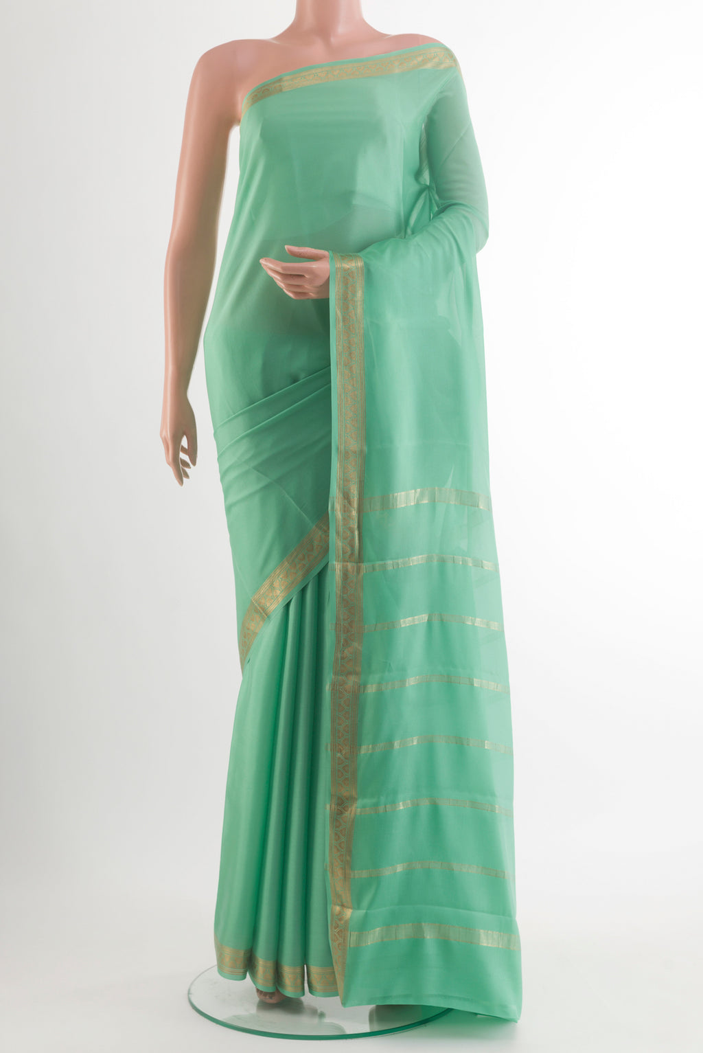 Mint Green Mysore Crepe Saree with Plain Body and Zari Border.  displayed on a mannequin