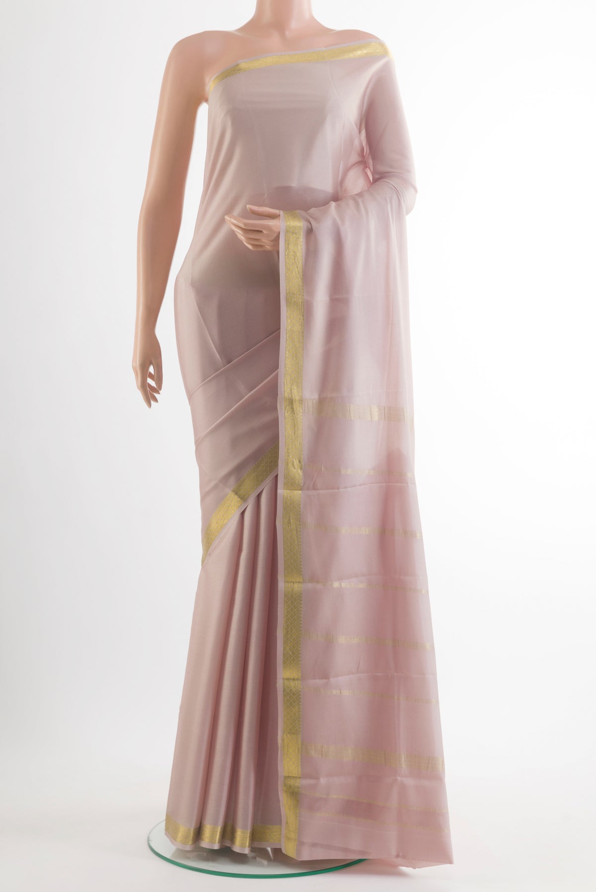 Beige Mysore Crepe Saree with Plain Body and Zari Border.  displayed on a mannequin