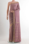 Rose Gold Mysore Crepe Saree with Plain Body and Zari Border.  displayed on a mannequin