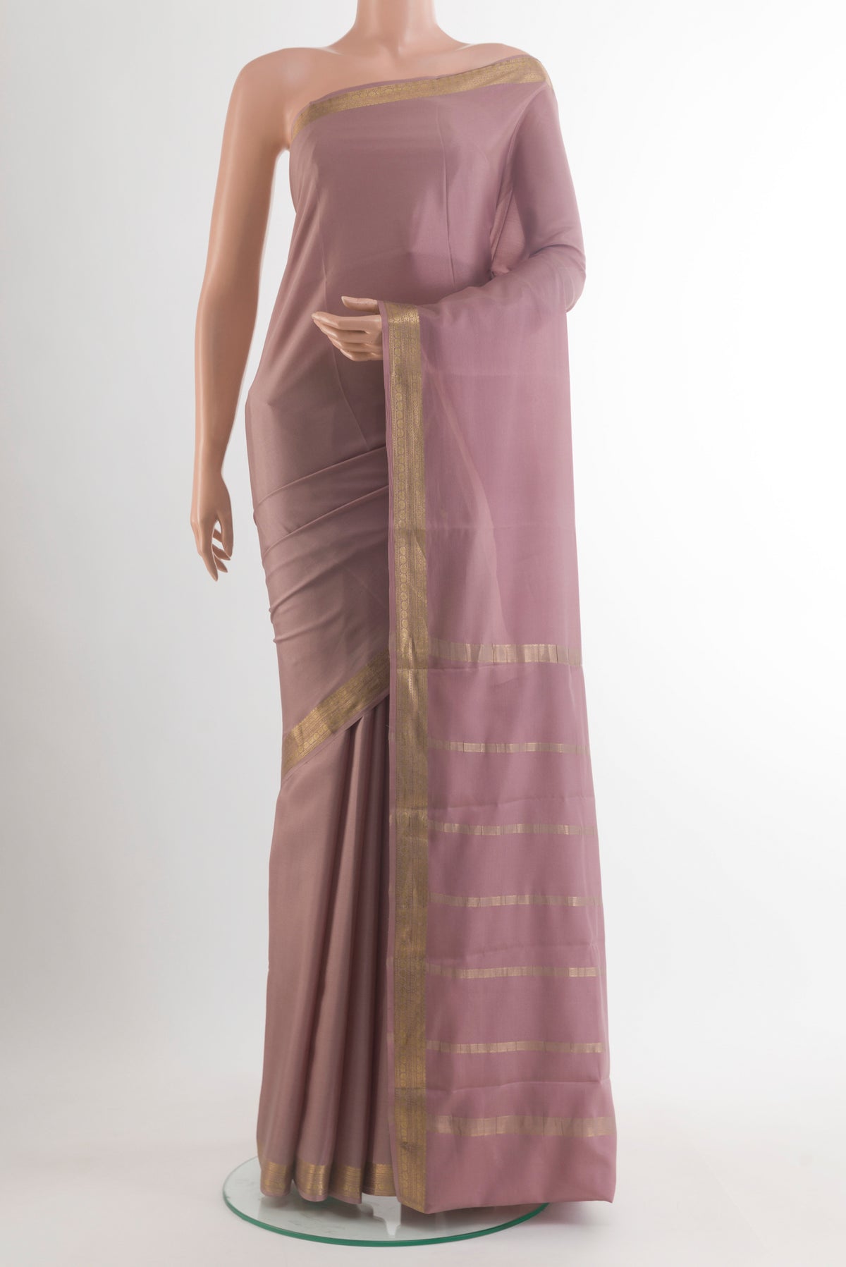 Rose Gold Mysore Crepe Saree with Plain Body and Zari Border.  displayed on a mannequin