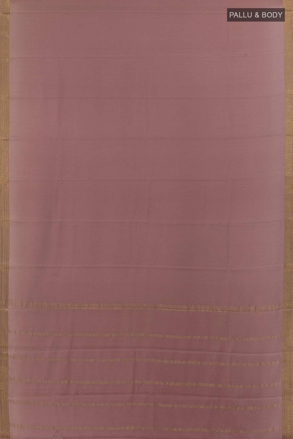 Flat view of Rose Gold Mysore Crepe Saree with Plain Body and Zari Border. 
