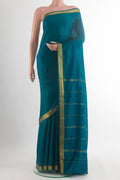 Teal Mysore Crepe Saree with Plain Body and Zari Border.  displayed on a mannequin