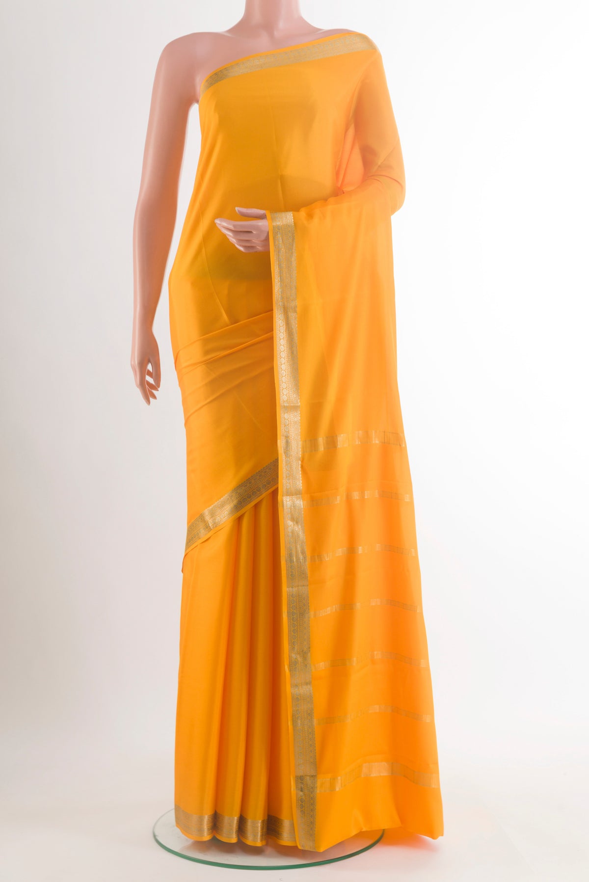 Yellow Mysore Crepe Saree with Plain Body and Zari Border.  displayed on a mannequin