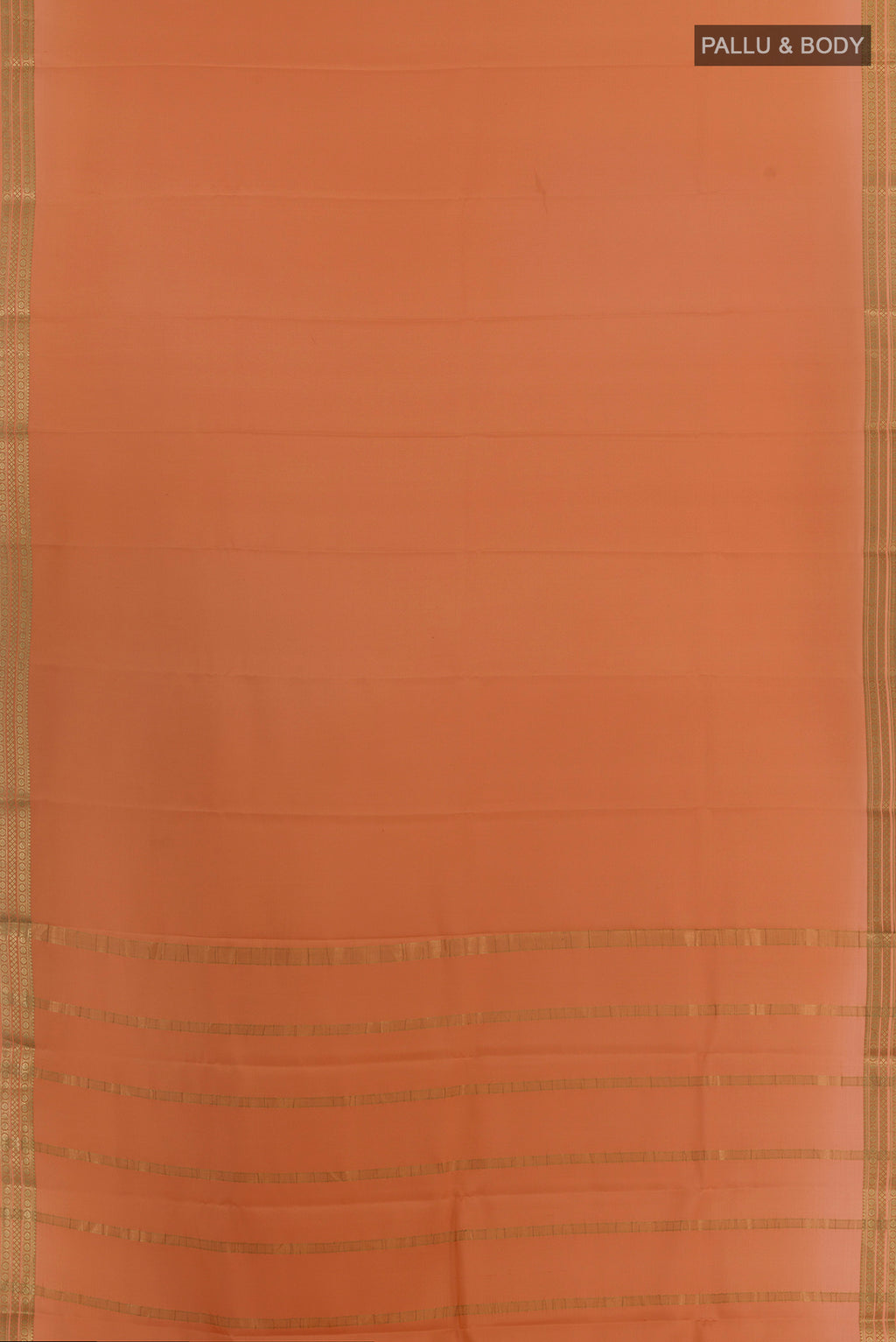 Flat view of Peach Mysore Crepe Saree with Plain Body and Zari Border. 