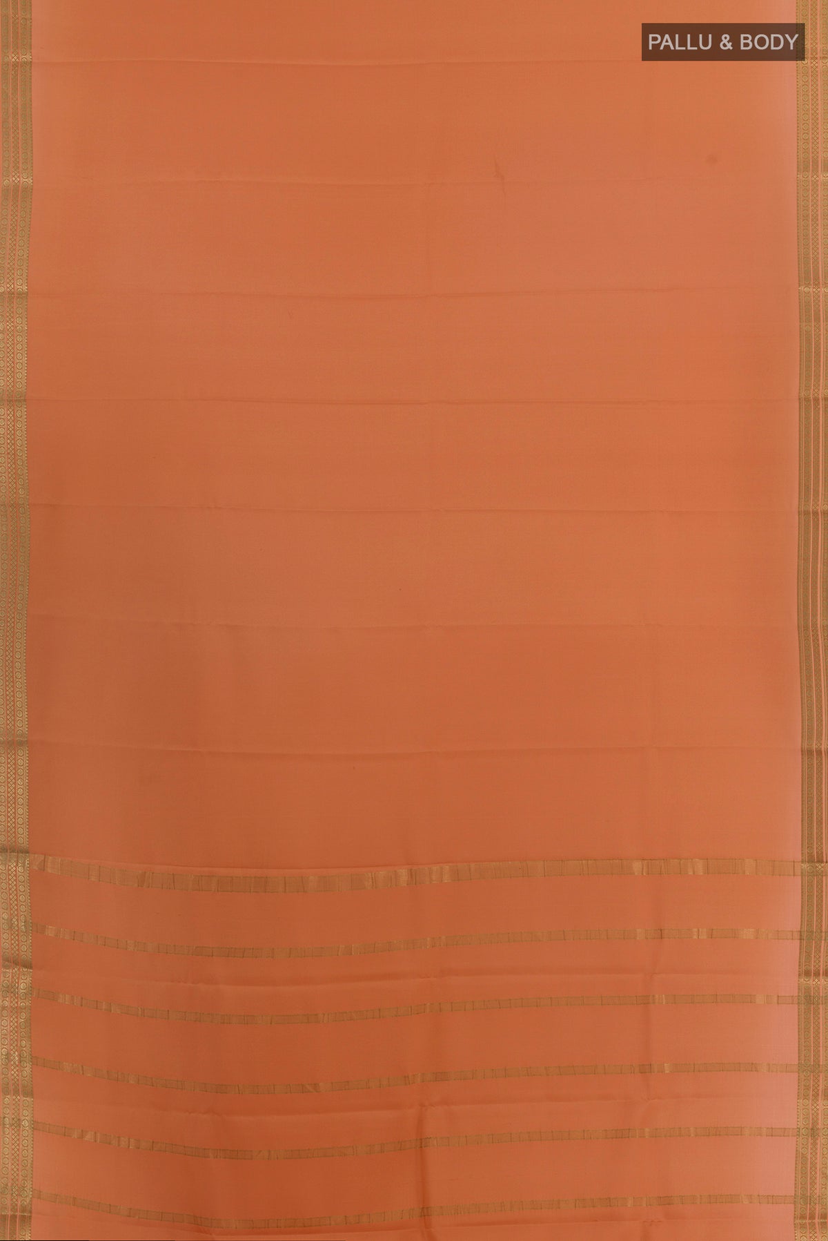 Flat view of Peach Mysore Crepe Saree with Plain Body and Zari Border. 