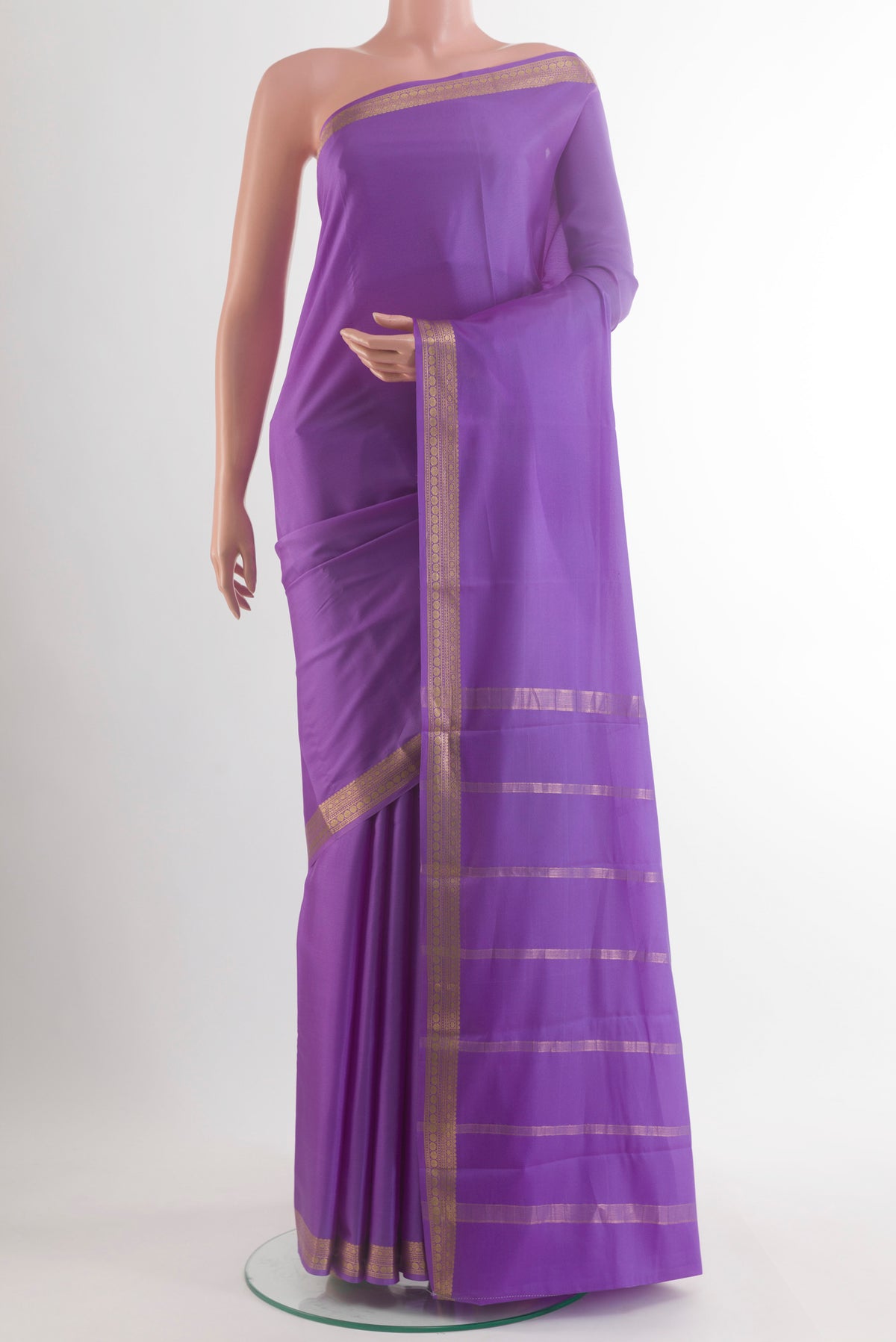 Lavender Mysore Crepe Saree with Plain Body and Zari Border.  displayed on a mannequin