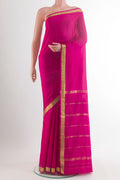 Pink Mysore Crepe Saree with Plain Body and Zari Border.  displayed on a mannequin