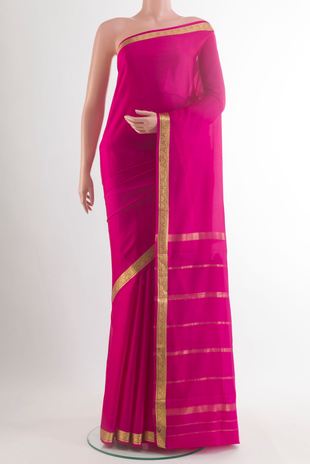 Pink Mysore Crepe Saree with Plain Body and Zari Border.  displayed on a mannequin