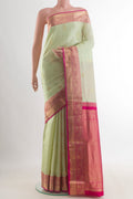 Pure Silk Cream Soft Saree with Zari Butta on the body and Zari Border.  displayed on a mannequin