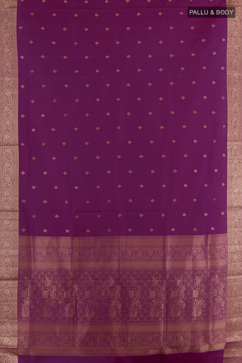 Flat view of Pure Silk Purple Soft Saree with Zari Butta on the body and Zari Border. 