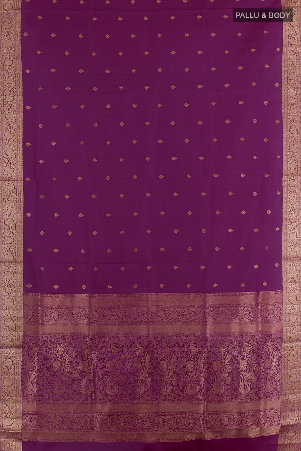 Flat view of Pure Silk Purple Soft Saree with Zari Butta on the body and Zari Border. 