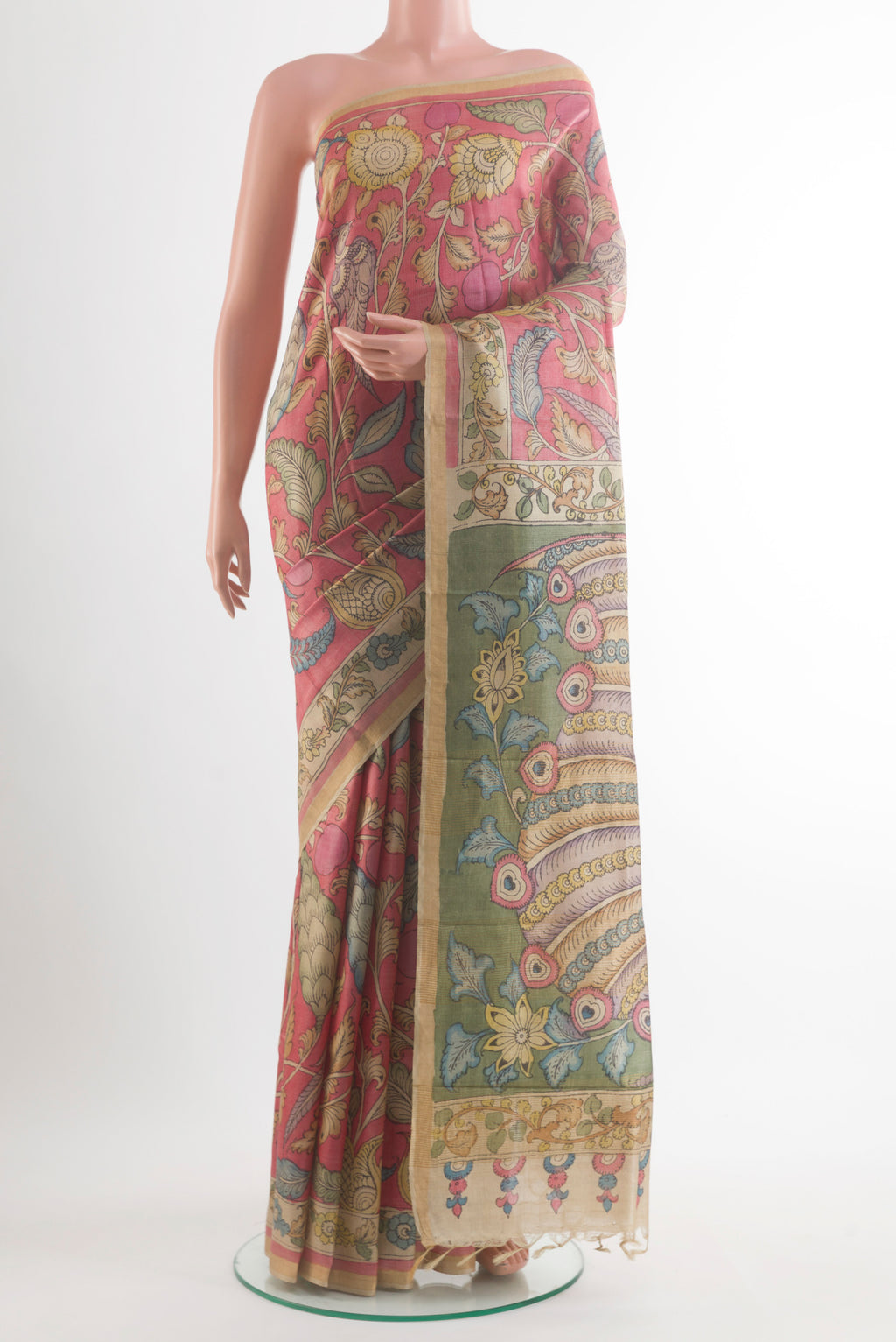 Peach Tussar Saree with kalamkari Print on the body and Zari Border.  displayed on a mannequin
