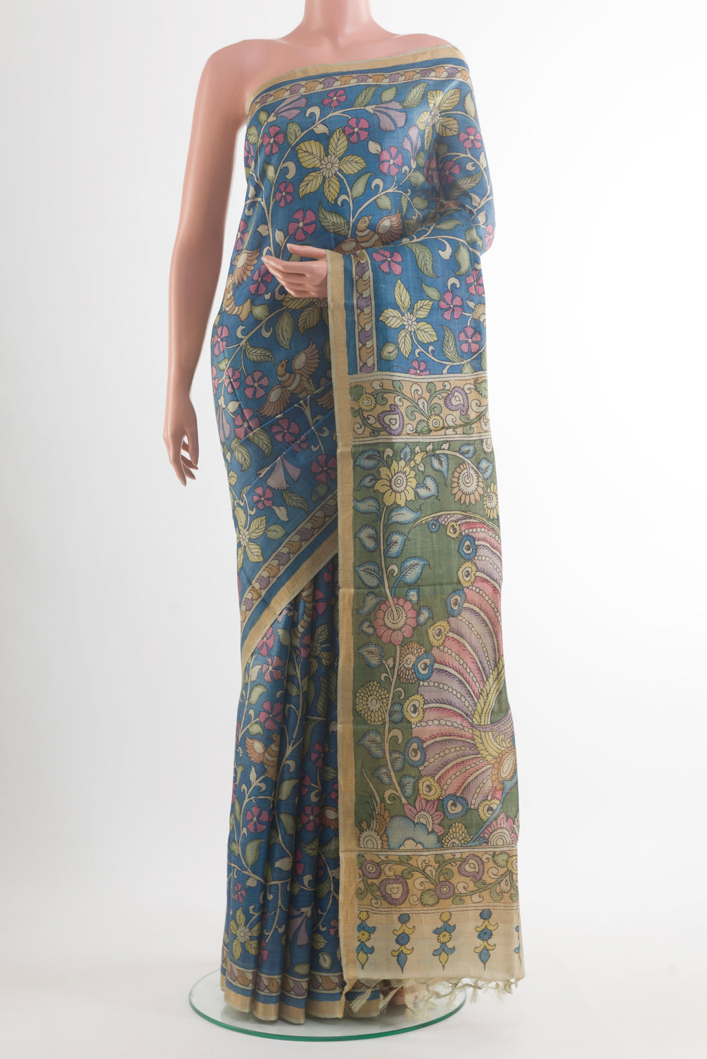 Blue Tussar Saree with kalamkari Print on the body and Zari Border.  displayed on a mannequin