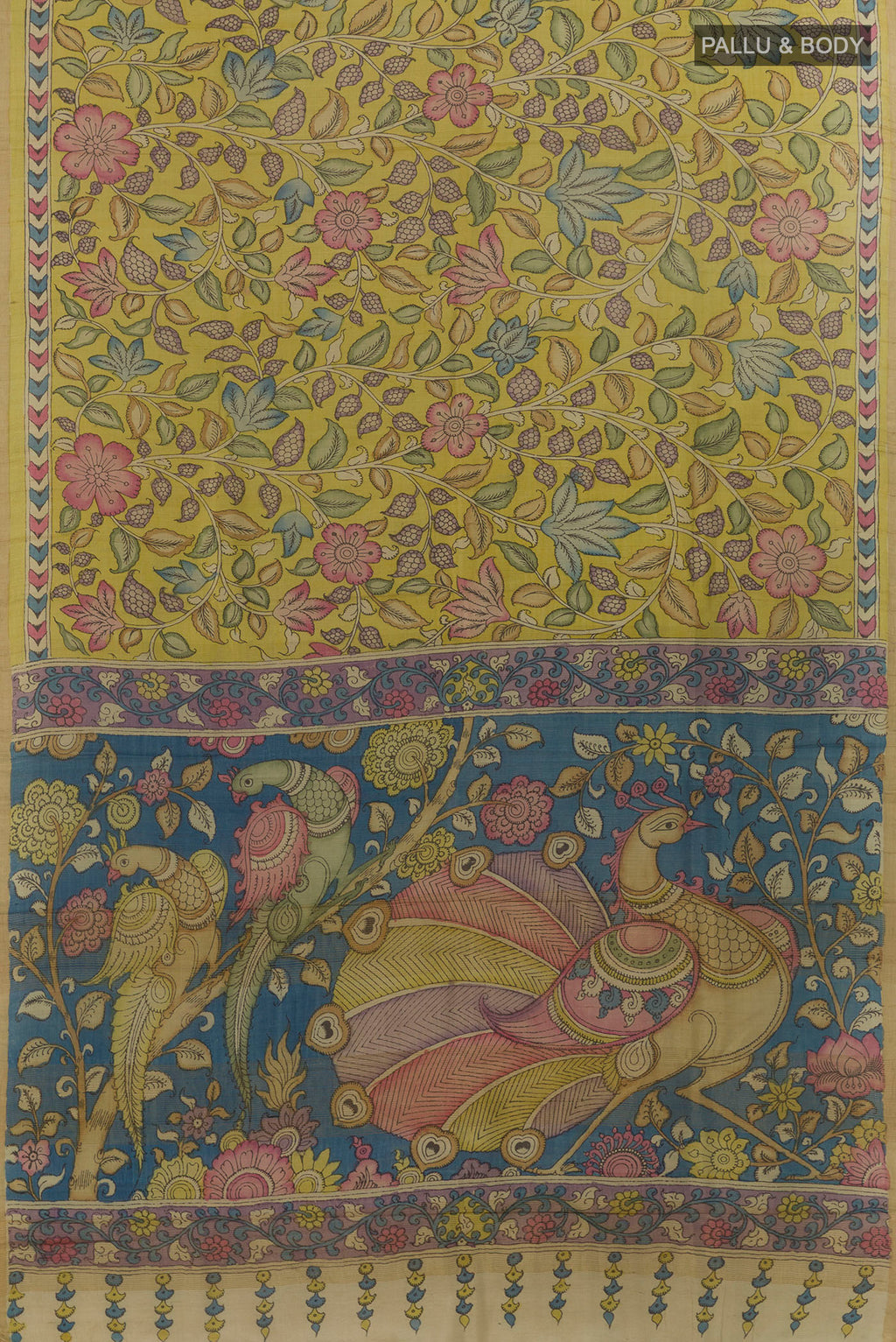 Flat view of Yellow Tussar Saree with kalamkari Print on the body and Zari Border. 