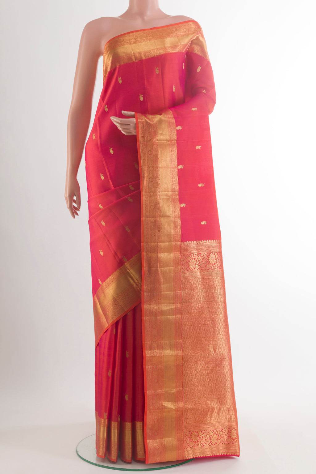 Pure Silk Red Kanjivaram Saree with Zari Butta on the body and Zari Border.  displayed on a mannequin