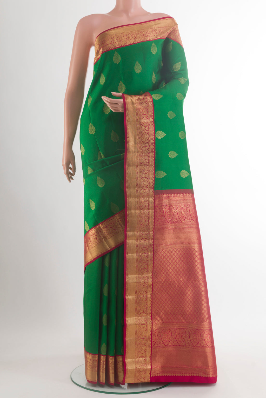 Pure Silk Green Kanchipuram Saree with Zari Butta on the body and Zari Border.  displayed on a mannequin