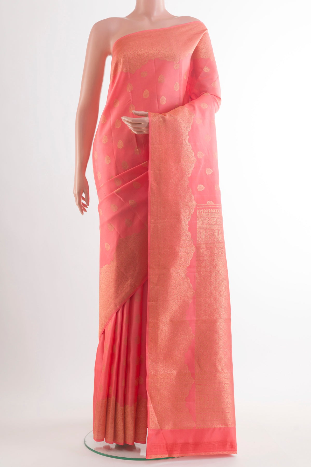 Pure Silk Pink Kanchipuram Saree with Zari Butta on the body and Zari Border.  displayed on a mannequin