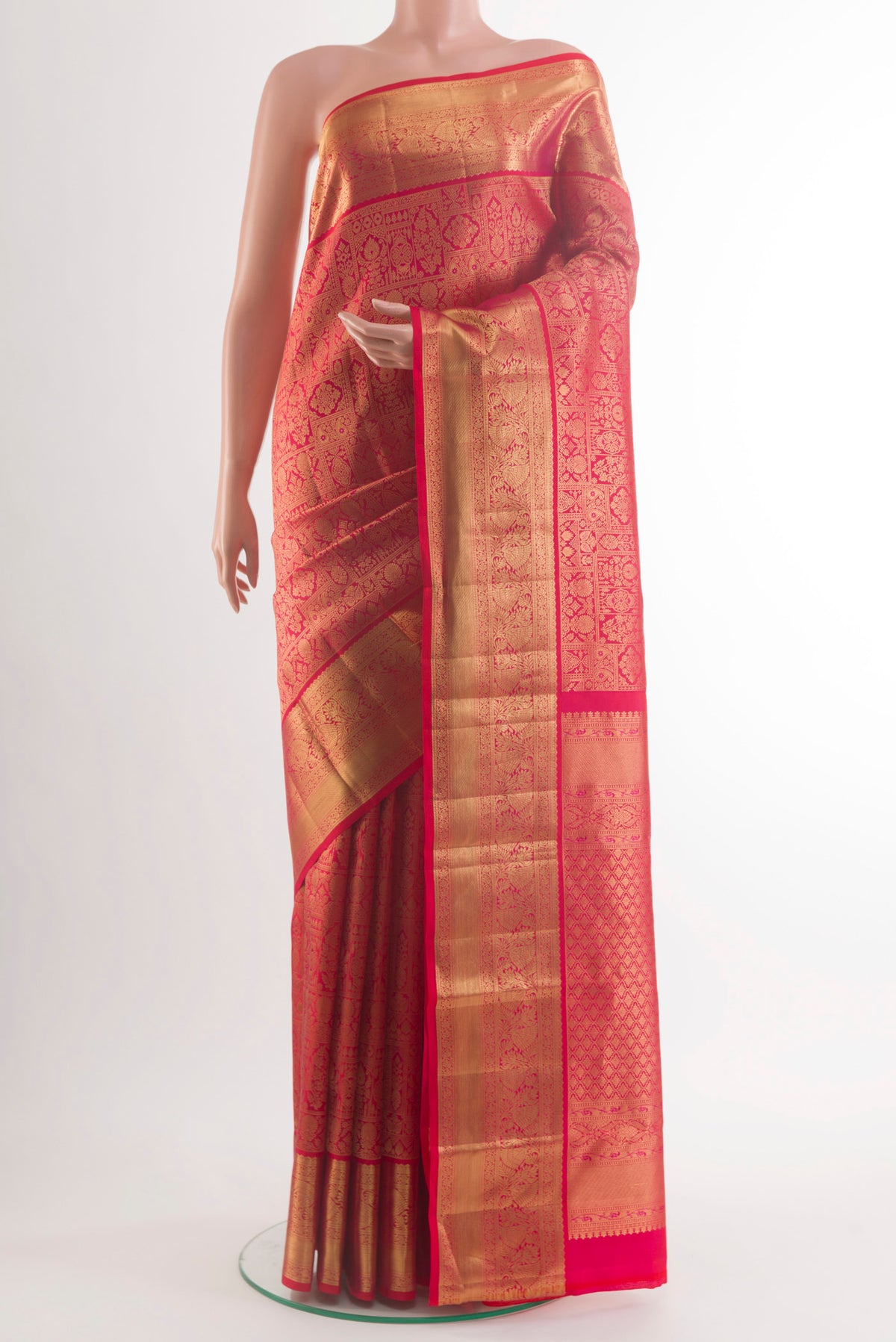 Pure Silk Red Kanchipuram Saree with Zari Brocade on the body and Zari Border.  displayed on a mannequin