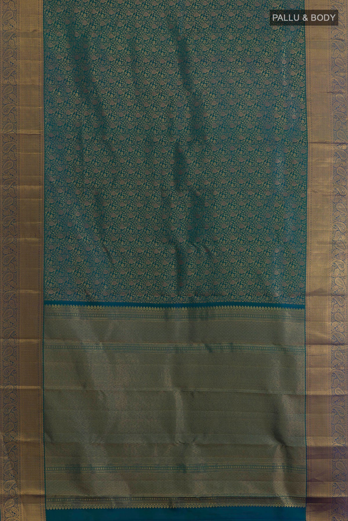 Flat view of Pure Silk Peacock Blue Dual Tone Kanchipuram Saree with Zari Brocade on the body and Zari Border. 