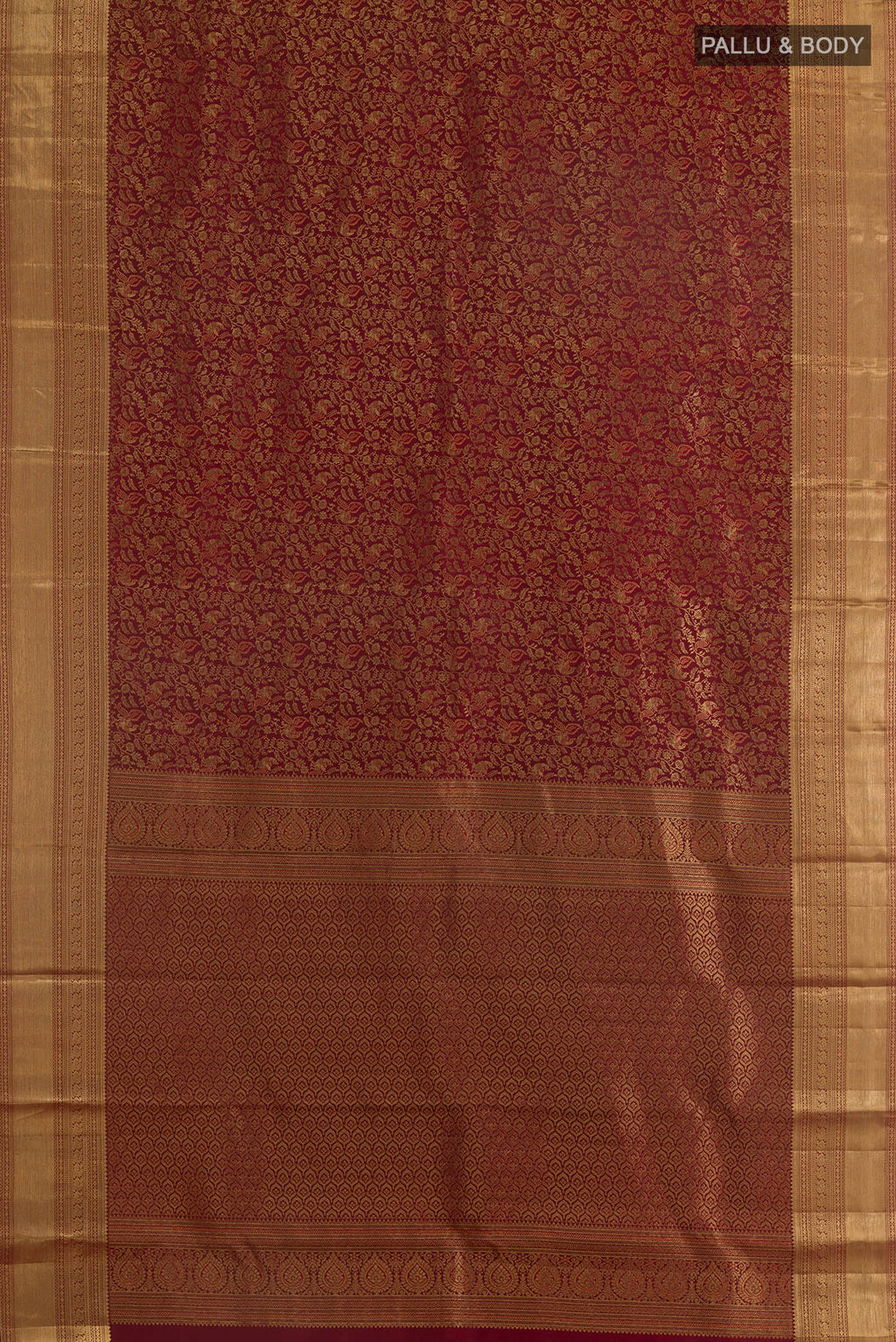 Flat view of Pure Silk Maroon Kanchipuram Saree with Zari Brocade on the body and Zari Border. 