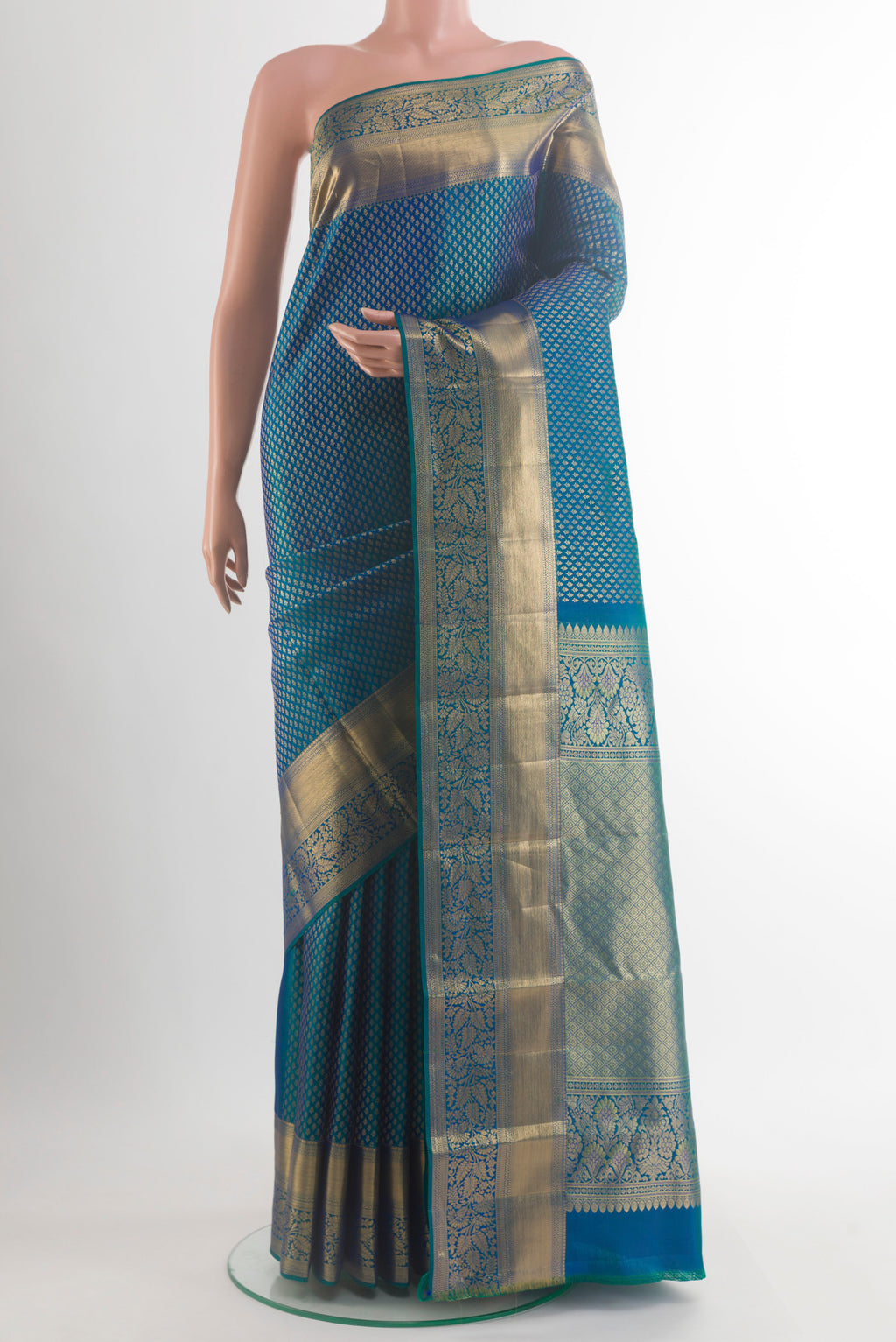 Pure Silk Peacock Blue Kanchipuram Saree with Zari Brocade on the body and Zari Border.  displayed on a mannequin