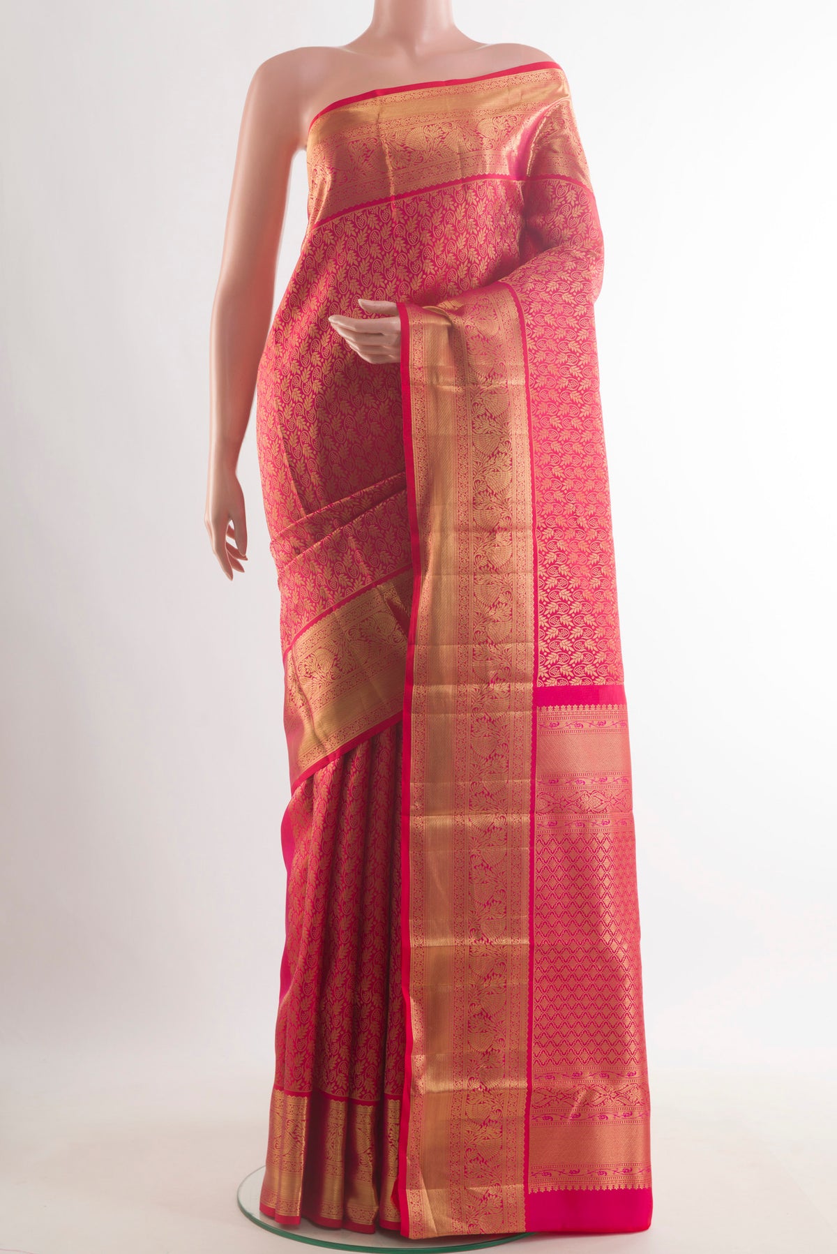 Pure Silk Pink Kanchipuram Saree with Zari Brocade on the body and Zari Border.  displayed on a mannequin