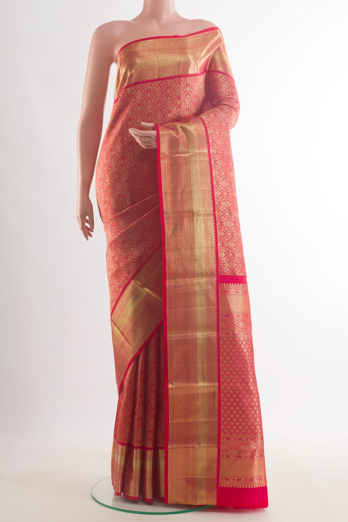 Pure Silk Red Kanchipuram Saree with Zari Brocade on the body and Zari Border.  displayed on a mannequin