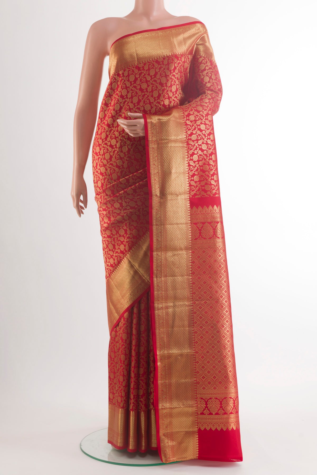 Pure Silk Red Kanchipuram Saree with Zari Brocade on the body and Zari Border.  displayed on a mannequin