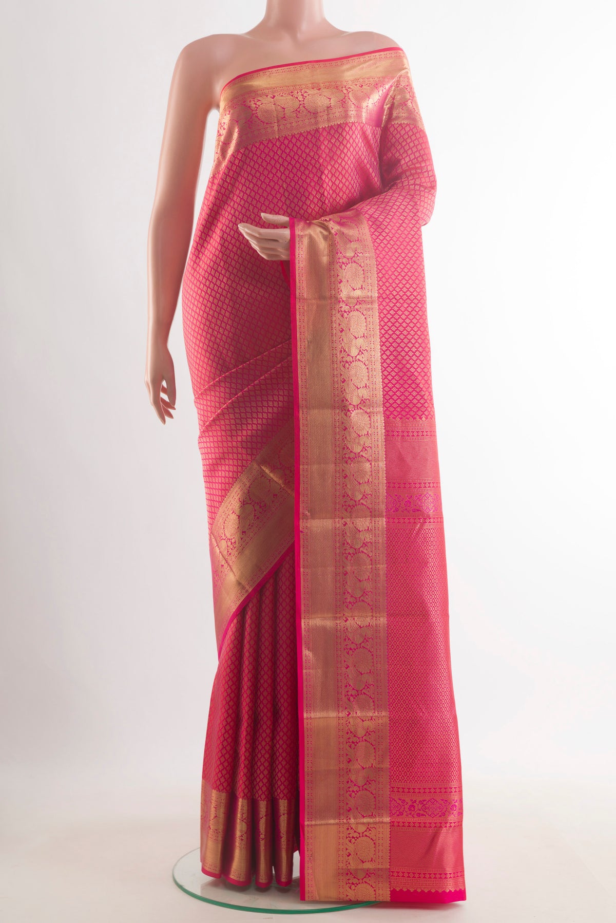 Pure Silk Pink Kanchipuram Saree with Zari Brocade on the body and Zari Border.  displayed on a mannequin