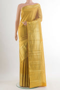 Pure Silk Mustard Kanchipuram Saree with Zari Brocade on the body and Zari Border.  displayed on a mannequin