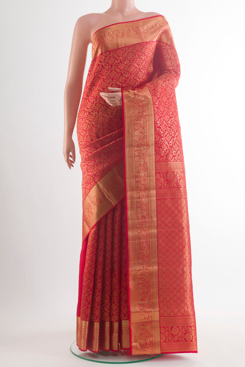 Pure Silk Red Kanchipuram Saree with Zari Butta on the body and Zari Border.  displayed on a mannequin