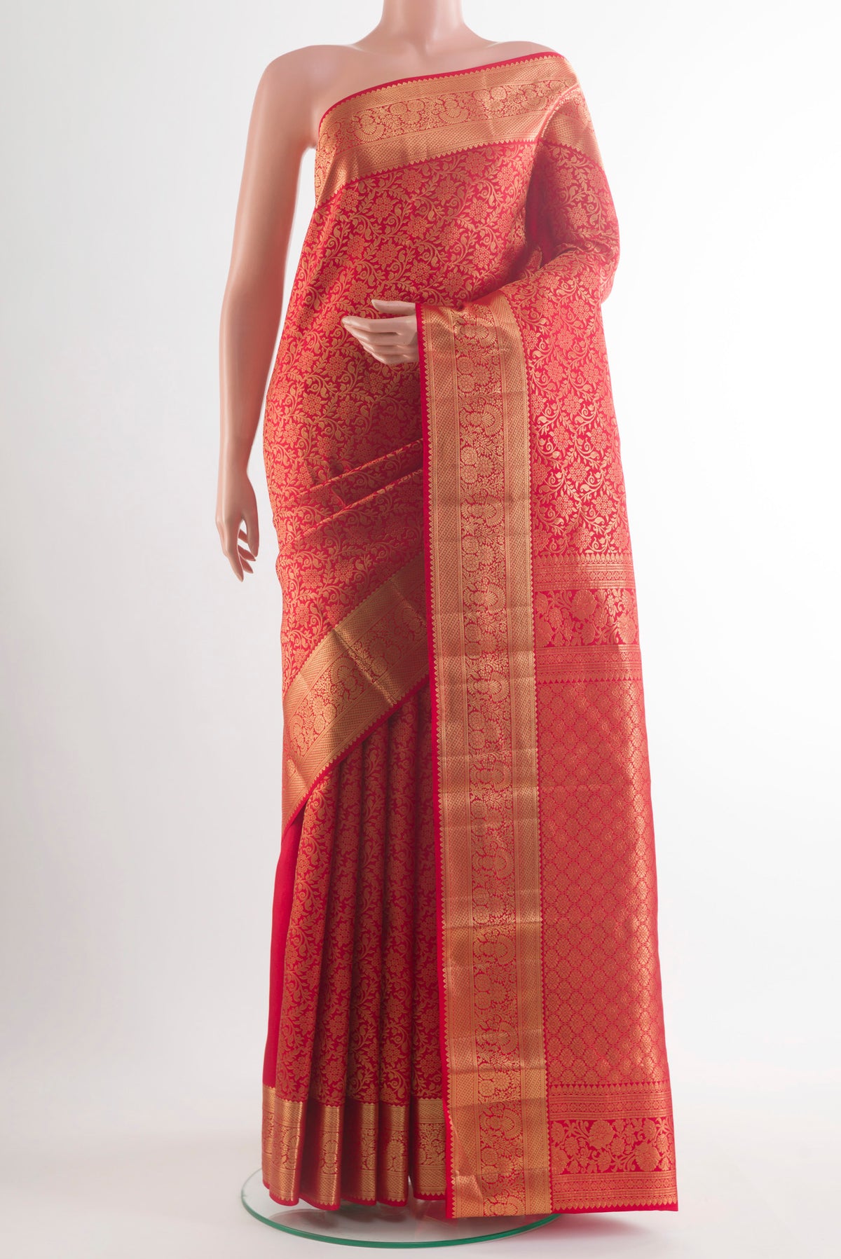 Pure Silk Red Kanchipuram Saree with Zari Butta on the body and Zari Border.  displayed on a mannequin