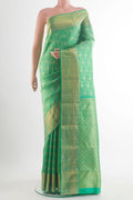 Pure Silk Green Kanchipuram Saree with Zari Brocade on the body and Zari Border.  displayed on a mannequin