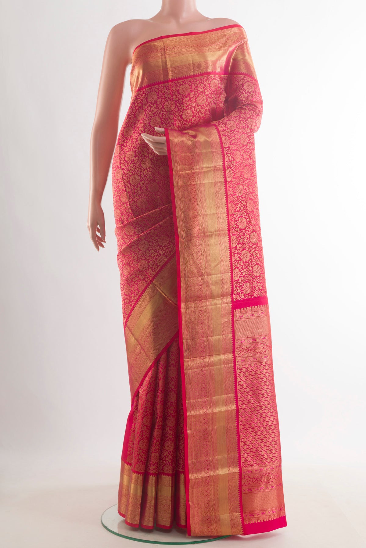 Pure Silk Red Kanchipuram Saree with Zari Brocade on the body and Zari Border.  displayed on a mannequin