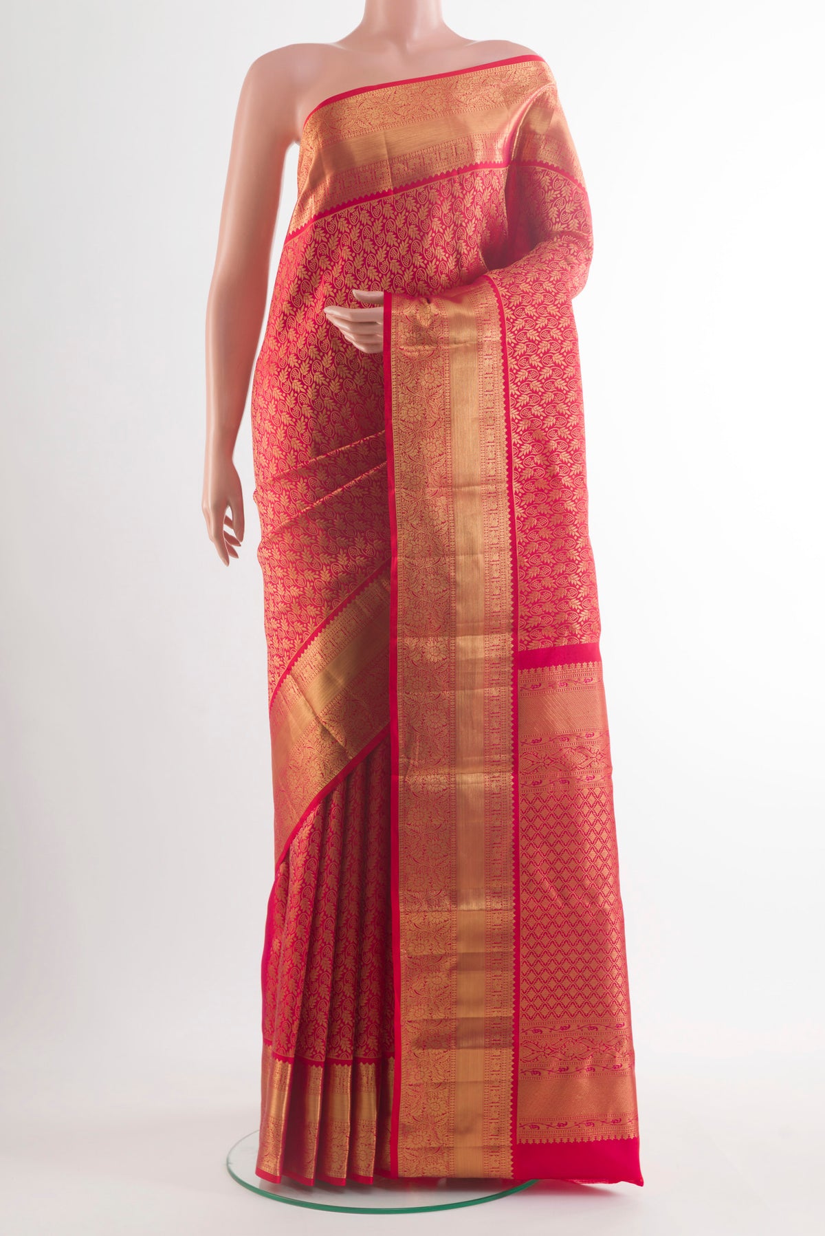 Pure Silk Red Kanchipuram Saree with Zari Butta on the body and Zari Border.  displayed on a mannequin