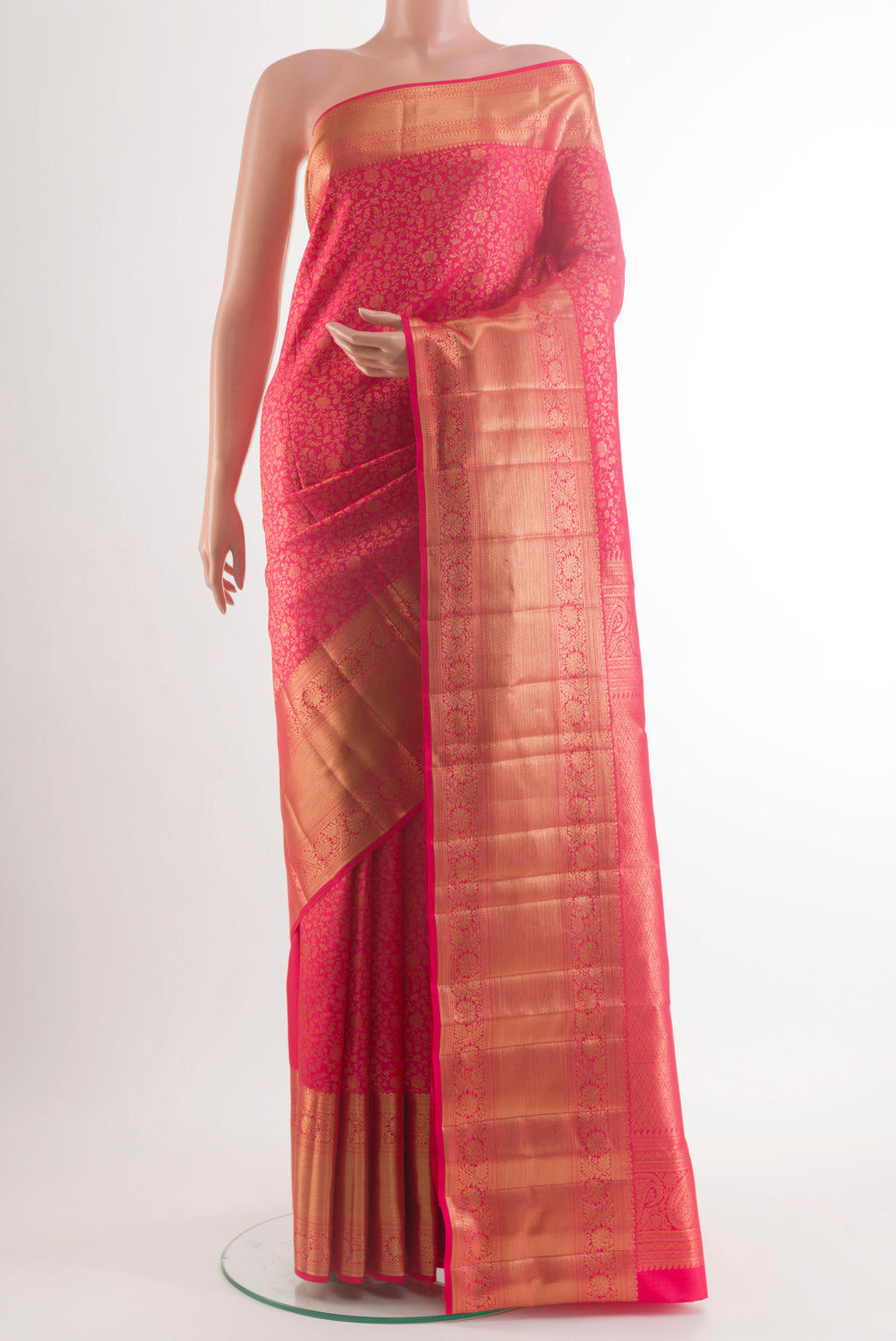 Pure Silk Pink Kanchipuram Saree with Zari Butta on the body and Zari Border.  displayed on a mannequin
