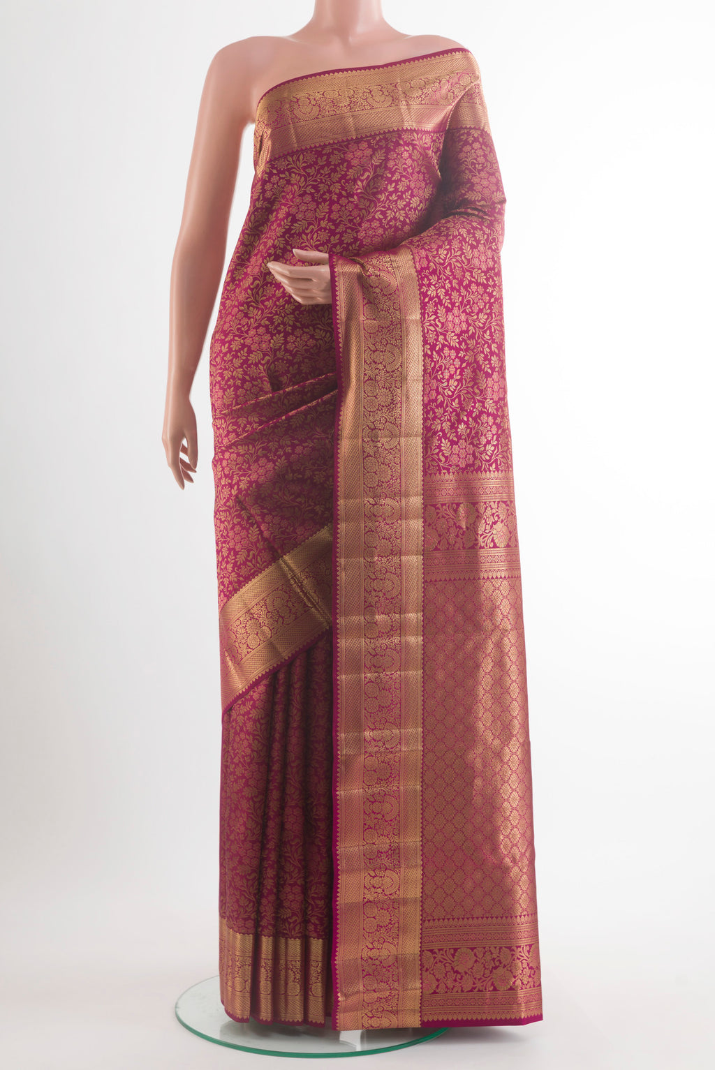 Pure Silk Maroon Kanchipuram Saree with Zari Brocade on the body and Zari Border.  displayed on a mannequin