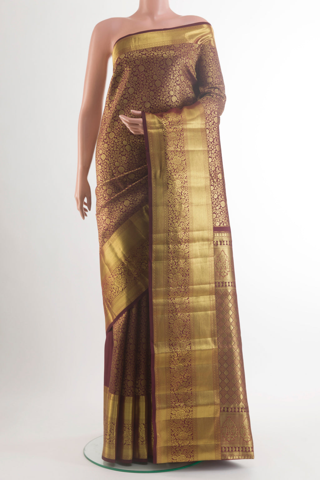 Pure Silk Coffee Brown Kanchipuram Saree with Zari Brocade on the body and Zari Border.  displayed on a mannequin