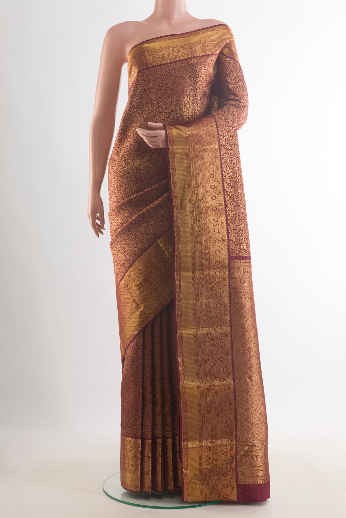 Pure Silk Maroon Kanchipuram Saree with Zari Brocade on the body and Zari Border.  displayed on a mannequin