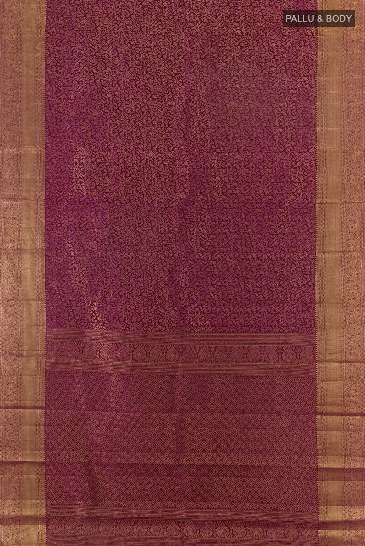 Flat view of Pure Silk Magenta Kanchipuram Saree with Zari Brocade on the body and Zari Border. 