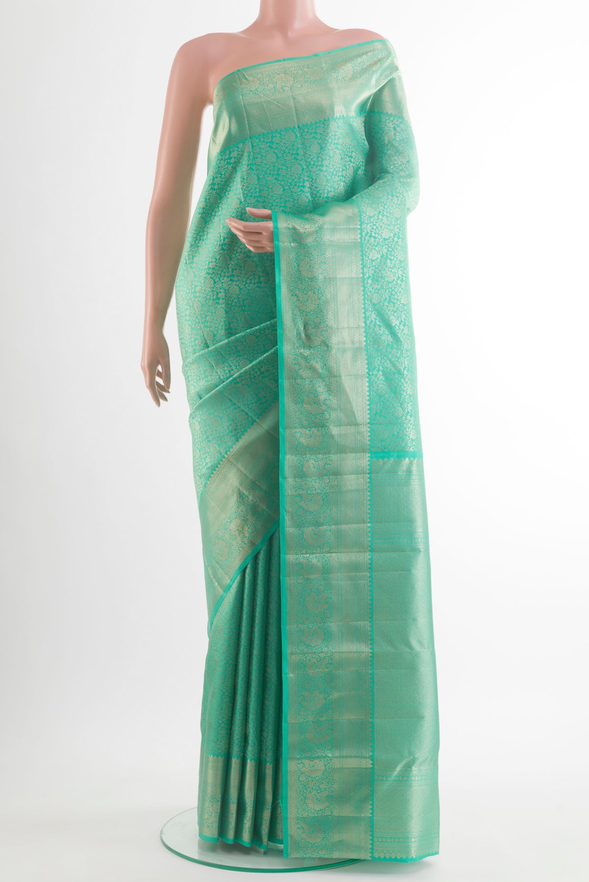 Pure Silk Sea Green Kanchipuram Saree with Zari Brocade on the body and Zari Border.  displayed on a mannequin