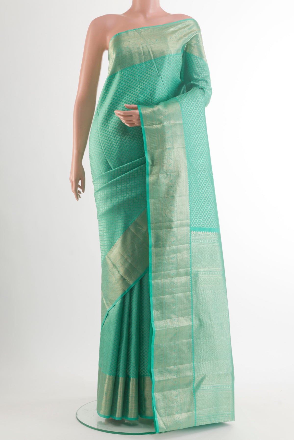 Pure Silk Sea Green Kanchipuram Saree with Zari Brocade on the body and Zari Border.  displayed on a mannequin