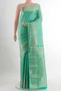 Pure Silk Sea Green Kanchipuram Saree with Zari Brocade on the body and Zari Border.  displayed on a mannequin