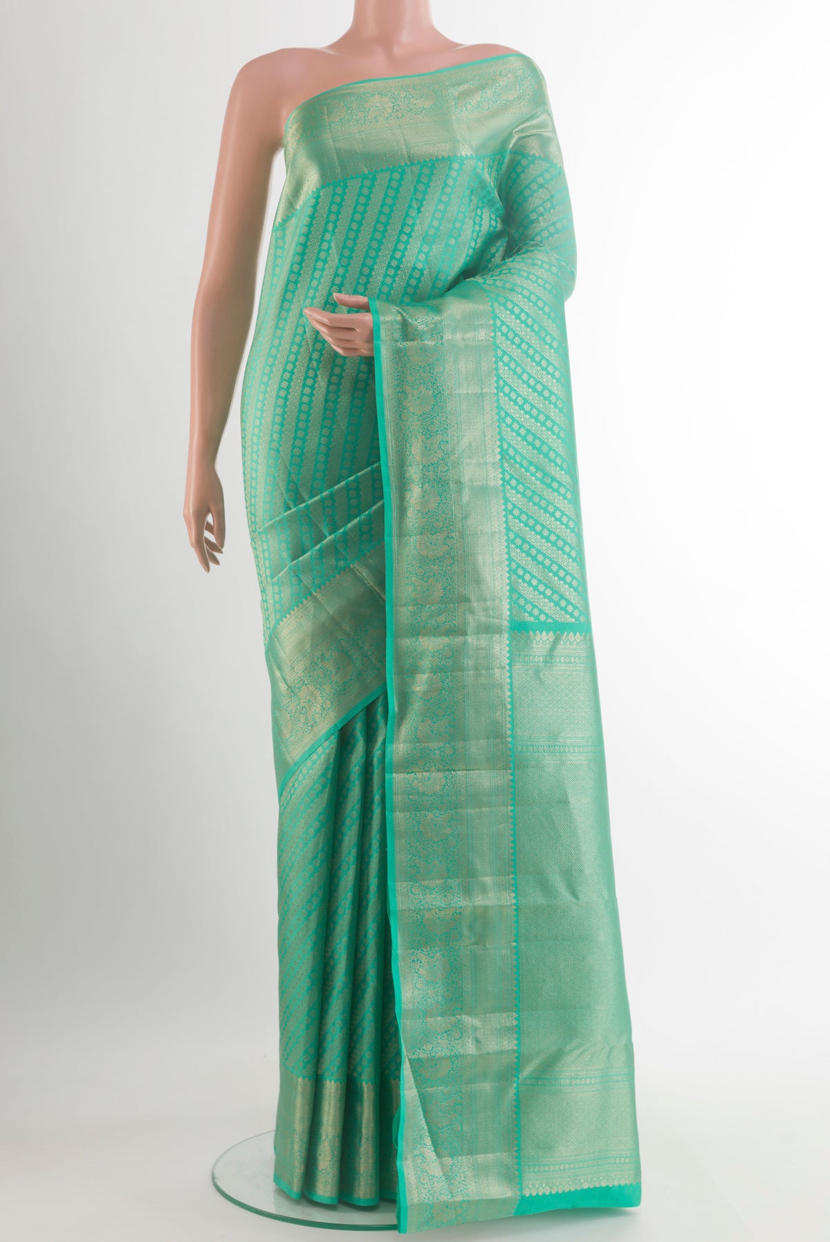 Pure Silk Sea Green Kanchipuram Saree with Zari Brocade on the body and Zari Border.  displayed on a mannequin