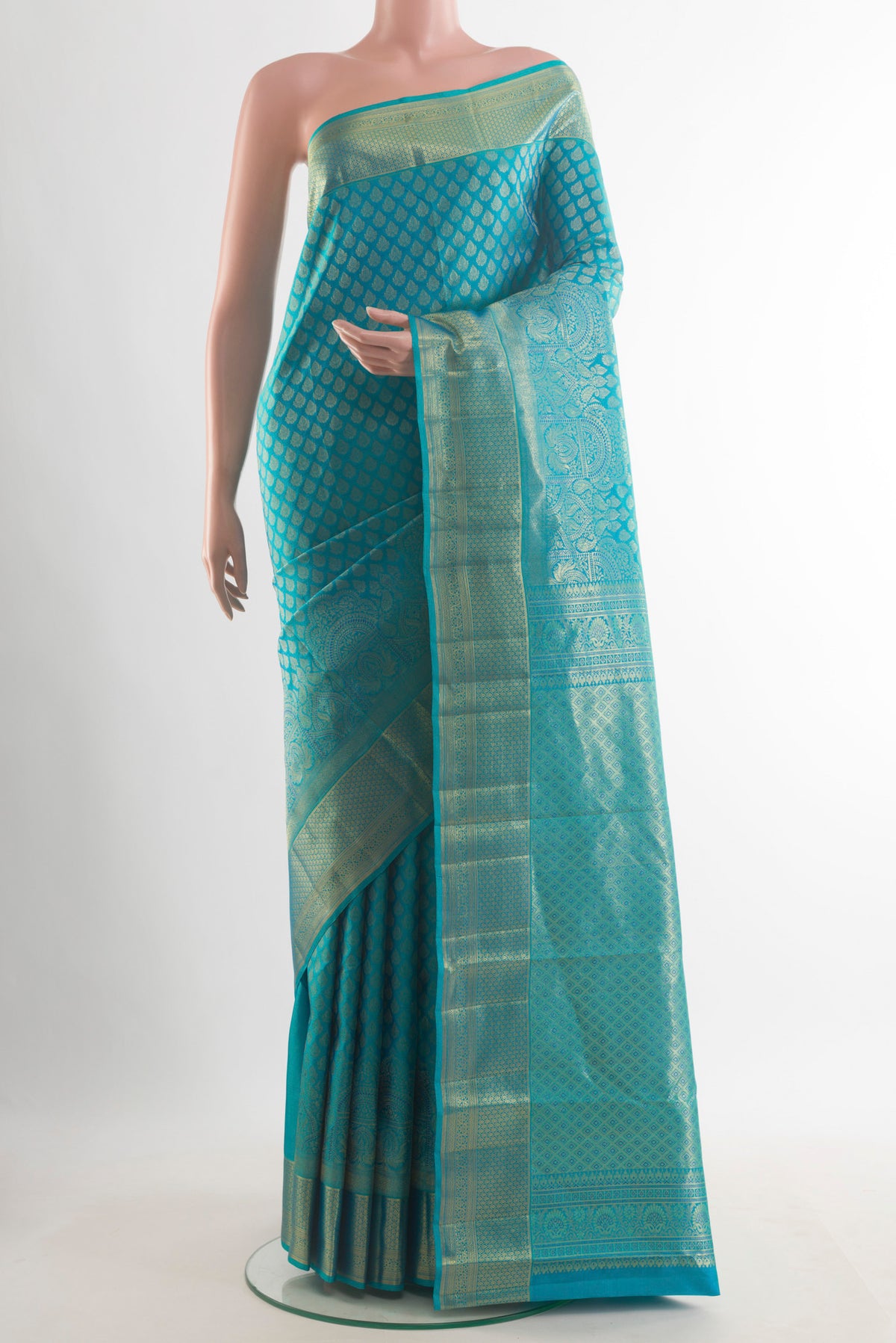 Pure Silk Blue Kanchipuram Saree with Zari Brocade on the body and Zari Border.  displayed on a mannequin